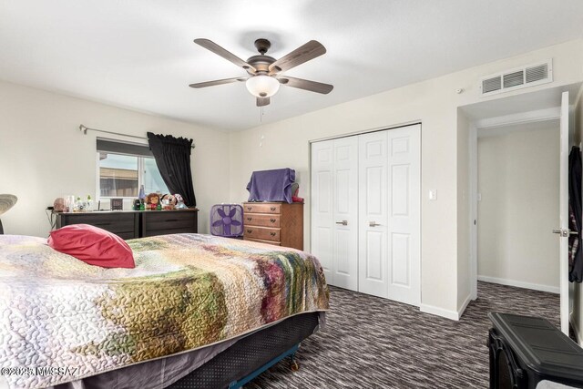 carpeted bedroom with a closet, visible vents, ceiling fan, and baseboards