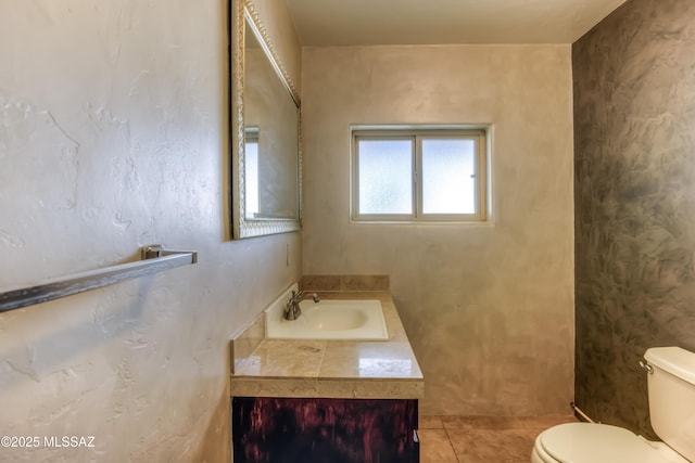 bathroom featuring tile patterned floors, toilet, and vanity