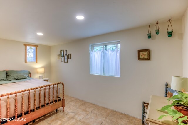 bedroom with recessed lighting and light tile patterned flooring