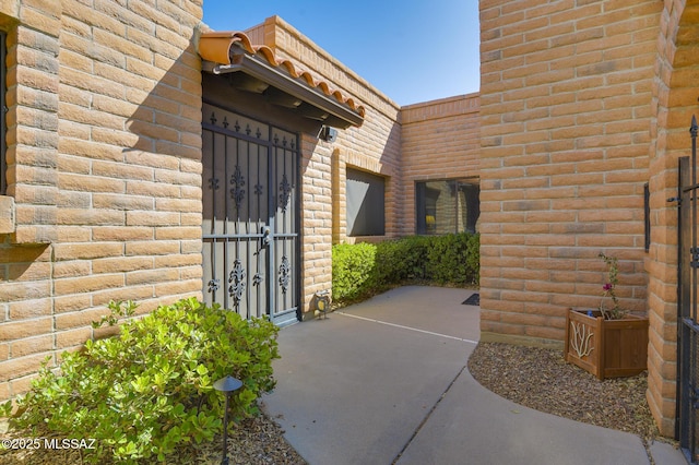 entrance to property with brick siding