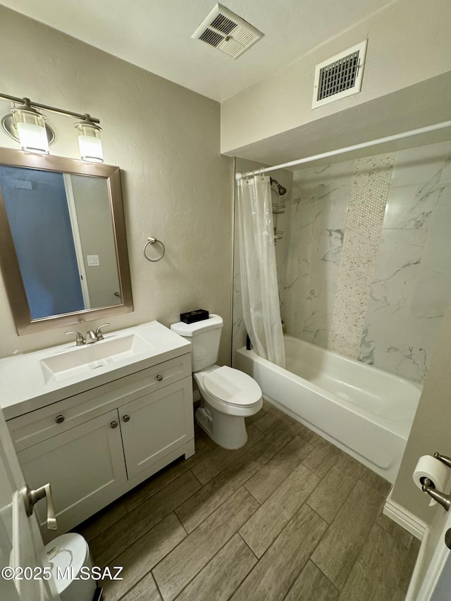 full bath with toilet, visible vents, shower / tub combo with curtain, and wood tiled floor