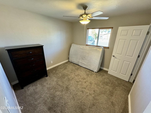 bedroom featuring baseboards, carpet floors, and a ceiling fan