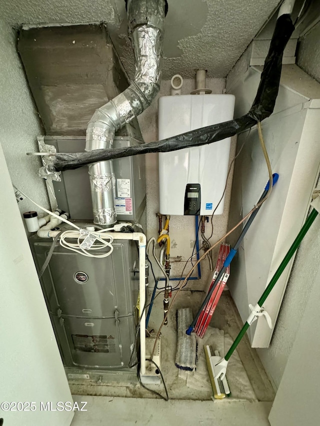 utility room with tankless water heater