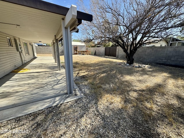 view of yard with a patio and a fenced backyard