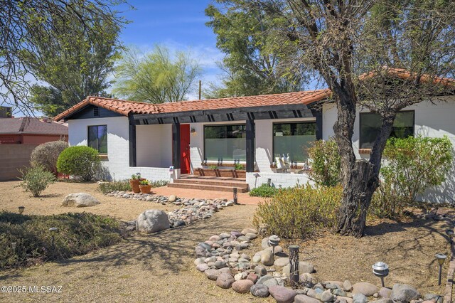view of front of home featuring a tiled roof