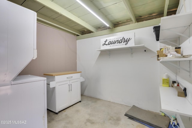 laundry area featuring stacked washer / dryer