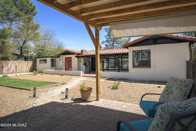 view of patio / terrace featuring fence