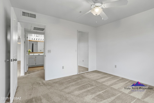 unfurnished bedroom with a ceiling fan, visible vents, and carpet floors