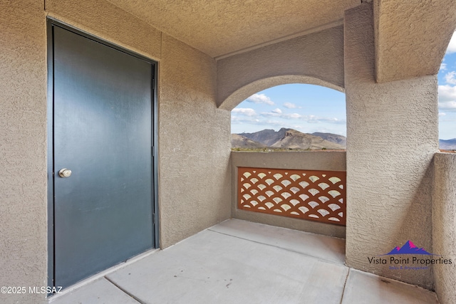 balcony featuring a mountain view