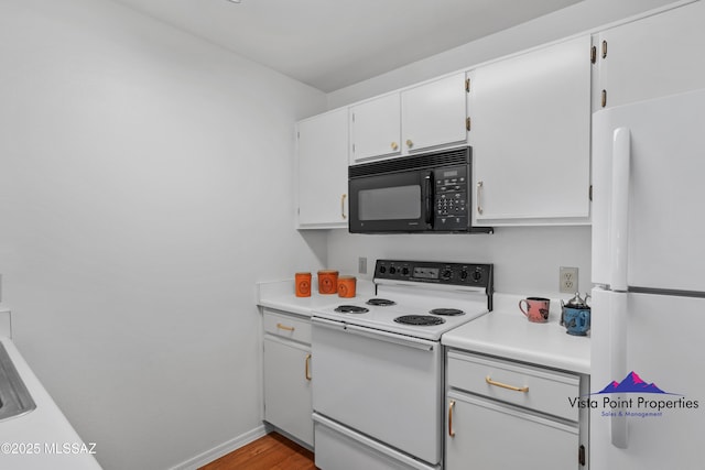 kitchen with wood finished floors, white cabinetry, white appliances, light countertops, and baseboards