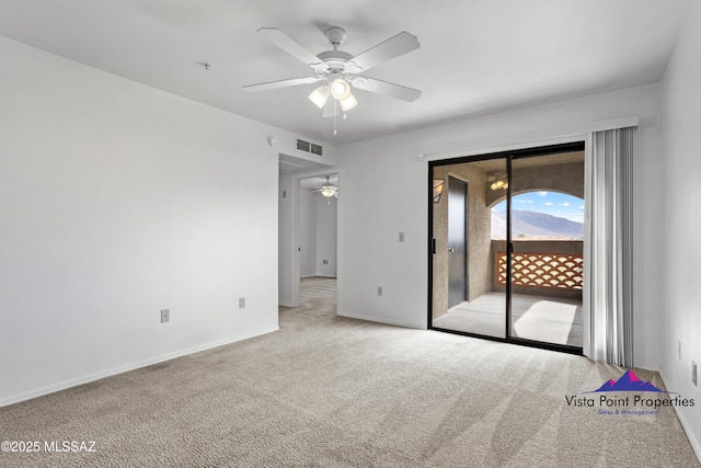 unfurnished room featuring visible vents, a ceiling fan, baseboards, and carpet floors