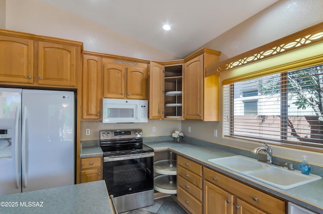 11092 N Eagle Crest Dr, Tucson, AZ 85737 - kitchen with white appliances, a sink, vaulted ceiling, light countertops, and recessed lighting