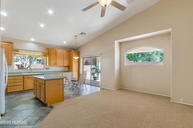 11092 N Eagle Crest Dr, Tucson, AZ 85737 - kitchen with a sink, a center island, recessed lighting, freestanding refrigerator, and ceiling fan