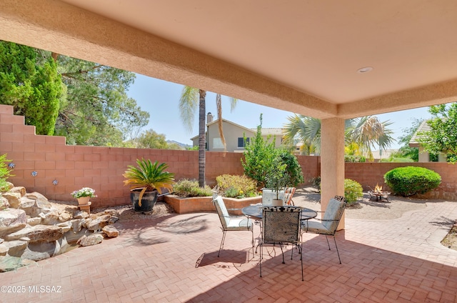 11092 N Eagle Crest Dr, Tucson, AZ 85737 - fenced backyard featuring a patio area, a fire pit, and outdoor dining area