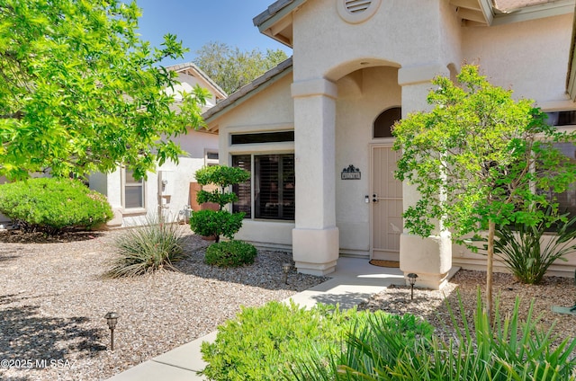 11092 N Eagle Crest Dr, Tucson, AZ 85737 - view of exterior entry with stucco siding