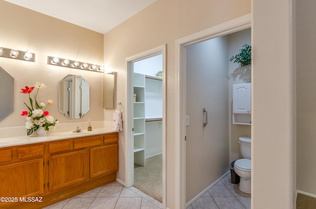 11092 N Eagle Crest Dr, Tucson, AZ 85737 - full bath featuring tile patterned floors, double vanity, toilet, and baseboards