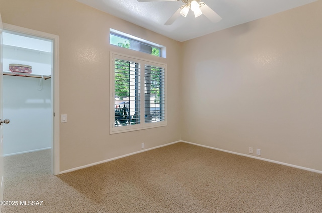11092 N Eagle Crest Dr, Tucson, AZ 85737 - unfurnished room with carpet, ceiling fan, and baseboards