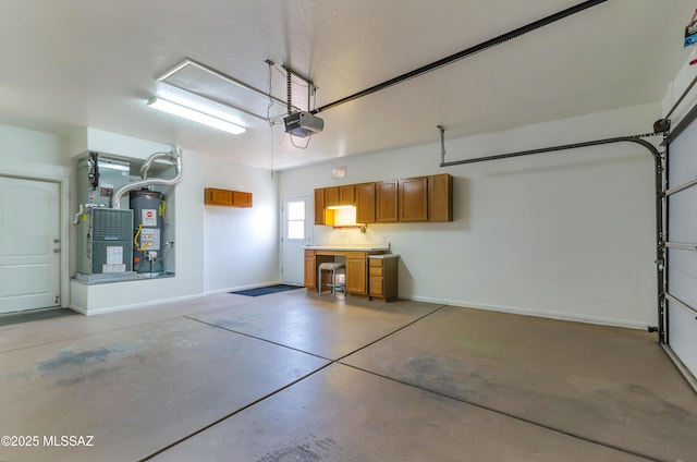 11092 N Eagle Crest Dr, Tucson, AZ 85737 - garage with a garage door opener, water heater, and baseboards