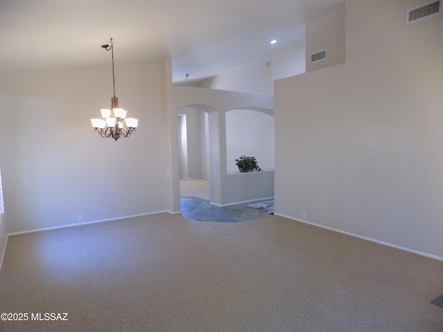 11092 N Eagle Crest Dr, Tucson, AZ 85737 - unfurnished room featuring carpet floors, a chandelier, arched walkways, high vaulted ceiling, and baseboards