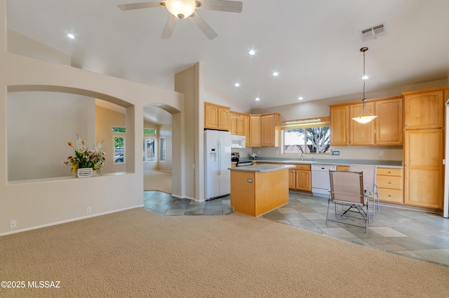 11092 N Eagle Crest Dr, Tucson, AZ 85737 - kitchen with white appliances, light carpet, recessed lighting, a center island, and arched walkways