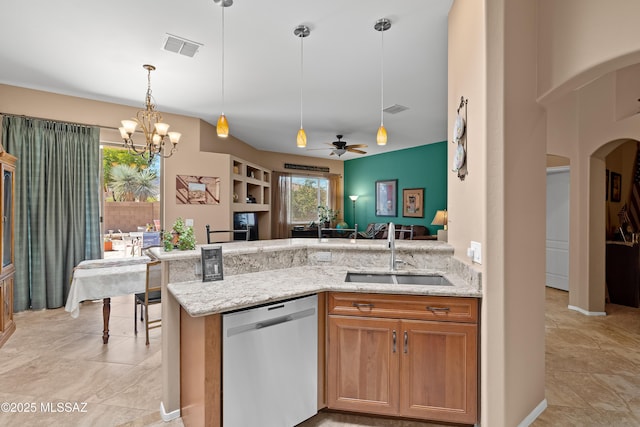 kitchen with stainless steel dishwasher, arched walkways, visible vents, and a sink