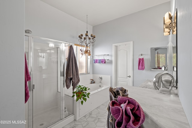 bathroom featuring tile patterned floors, a bath, a stall shower, and a chandelier