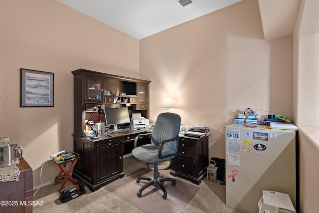 office space featuring carpet flooring and visible vents