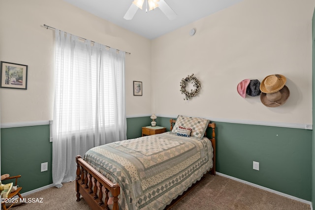 bedroom with baseboards, a ceiling fan, and carpet flooring