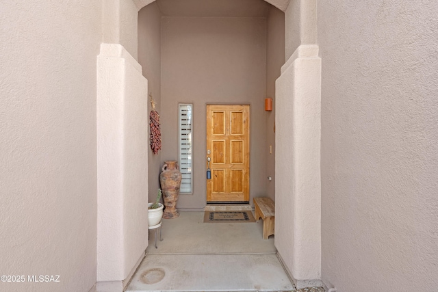 view of exterior entry featuring stucco siding