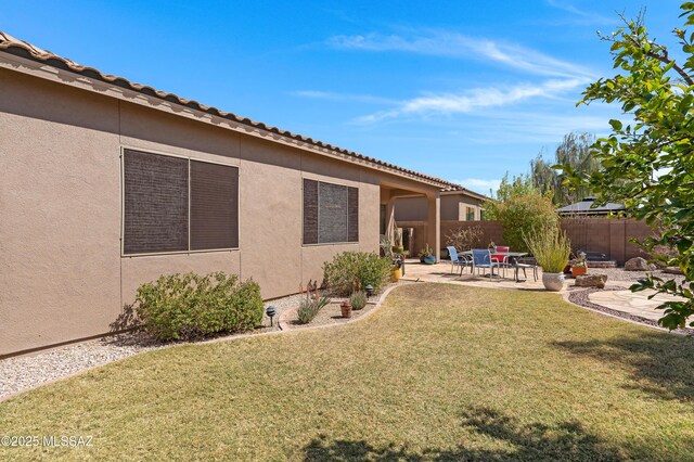 view of yard featuring a patio area and fence