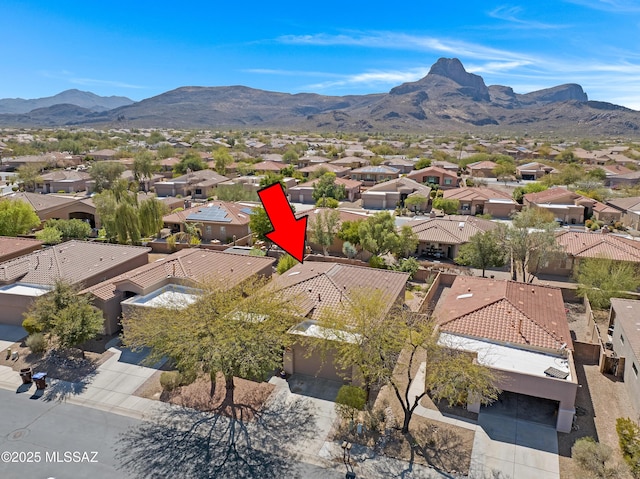 birds eye view of property with a residential view and a mountain view