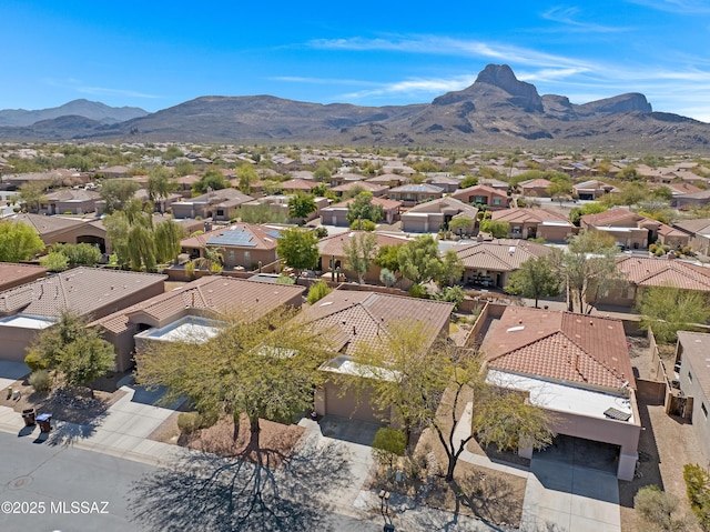 drone / aerial view featuring a residential view and a mountain view