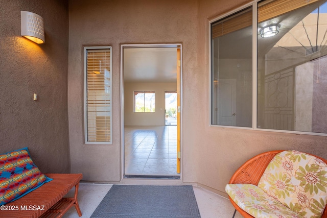 property entrance featuring stucco siding