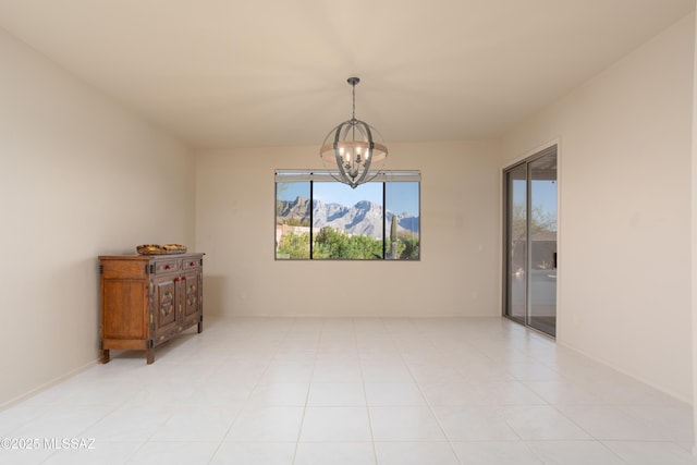 spare room with light tile patterned floors and a notable chandelier