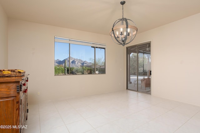 empty room featuring a chandelier