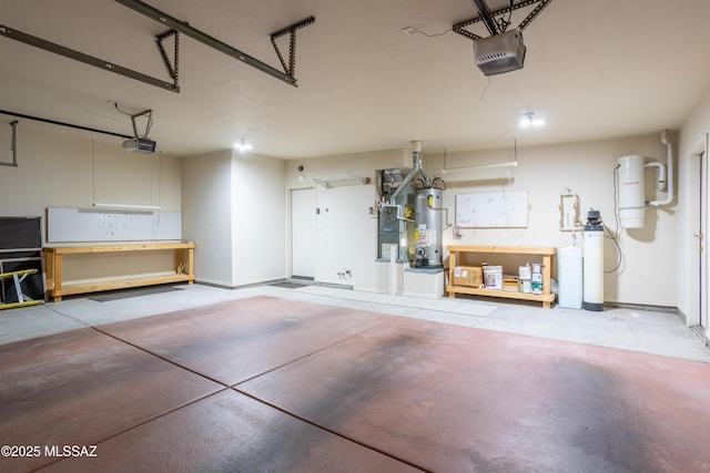 garage featuring a garage door opener, water heater, and baseboards