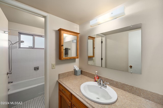 full bath featuring tile patterned flooring, vanity, and bathing tub / shower combination