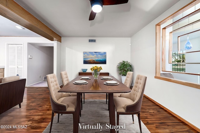 dining area with visible vents, baseboards, and wood finished floors