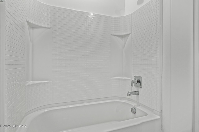 bathroom with shower / washtub combination