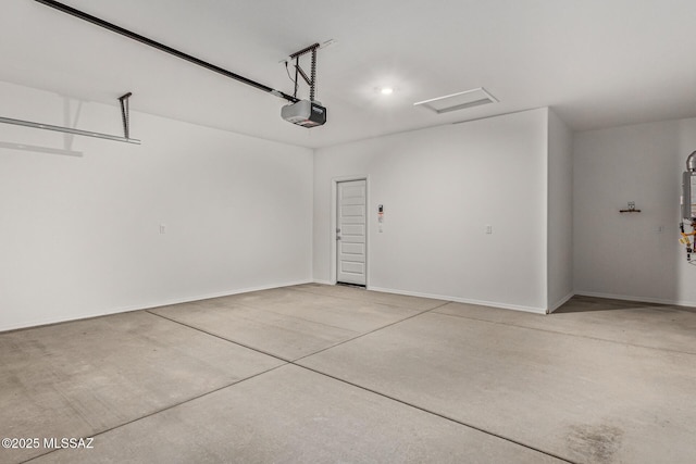 garage featuring baseboards and a garage door opener