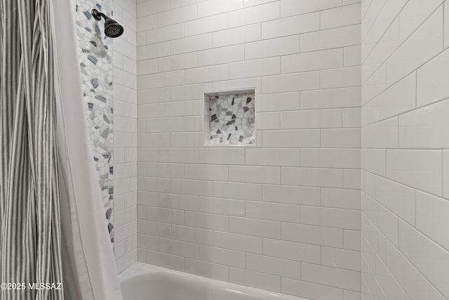 bathroom featuring shower / bathtub combination with curtain