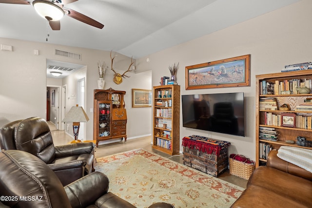 living area with visible vents, a ceiling fan, and vaulted ceiling