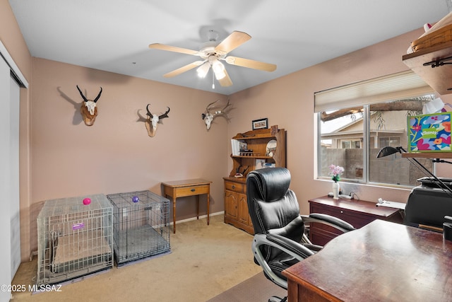 office featuring light colored carpet and ceiling fan