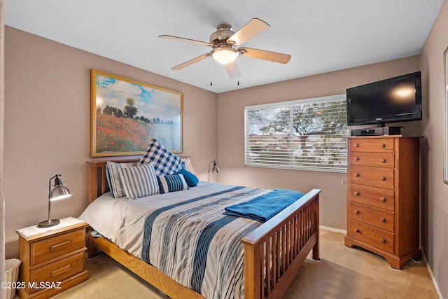 bedroom with baseboards, light carpet, and a ceiling fan