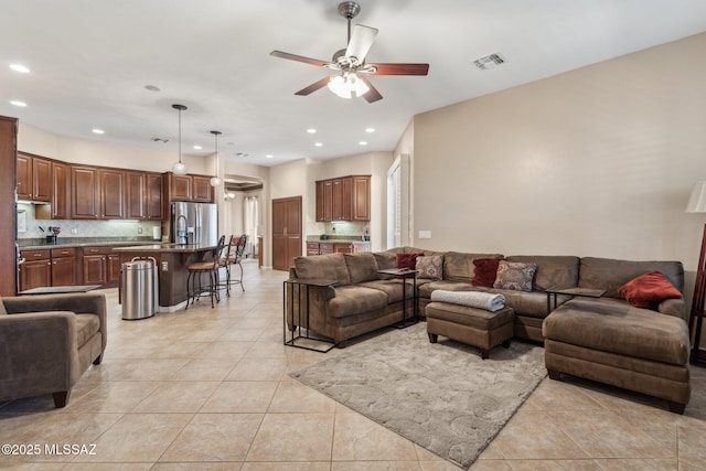 living area featuring recessed lighting, visible vents, ceiling fan, and light tile patterned floors