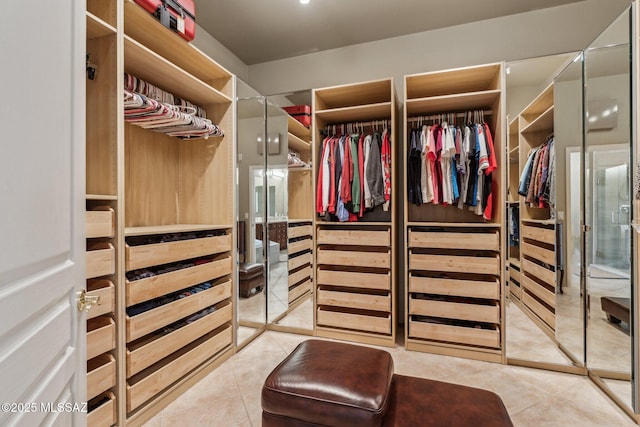 spacious closet featuring tile patterned floors