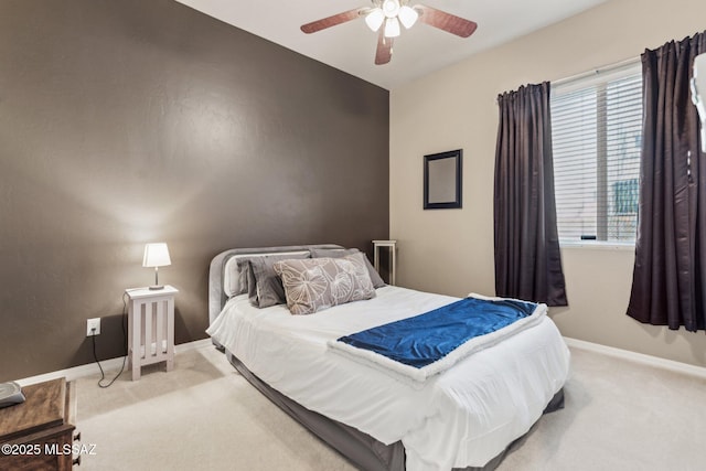 bedroom featuring light carpet, ceiling fan, and baseboards