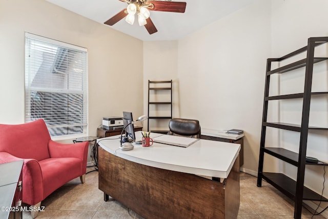 office featuring light tile patterned flooring, a ceiling fan, and baseboards