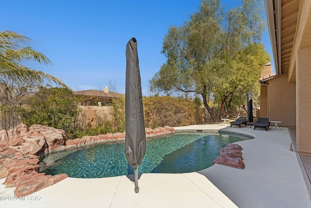 view of pool featuring a patio, fence, and a fenced in pool