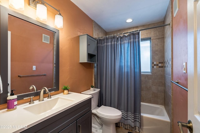 bathroom featuring visible vents, shower / bath combination with curtain, toilet, and vanity